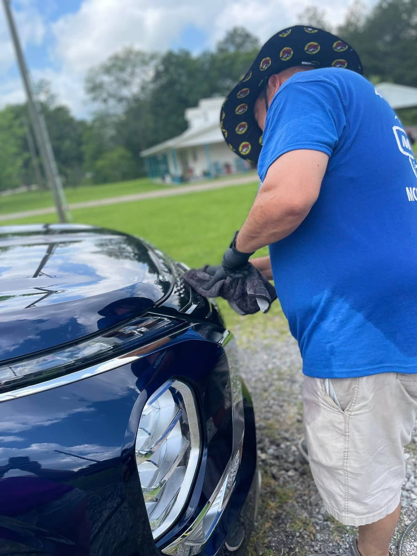 Owner of Moreno Detailing SETX hand-drying a detailed vehicle